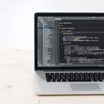 macbook pro on white table